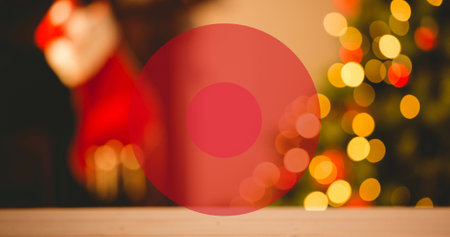 Image of two red concentric circles over out of focus christmas stocking and christmas tree. Christmas, festivity, tradition and celebration concept.の写真素材
