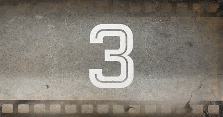 Composite of white colored number 3 text on old gray negative camera film, copy space. Digits, counting, abstract, retro, antique and photography concept.の写真素材