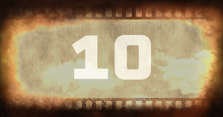 Composite of number 10 text over old rusty negative camera film with vignette, copy space. Digits,...