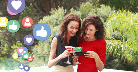 Image of social media reactions and happy caucasian women with smartphone and drinks. Social media,...