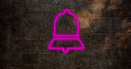 Composite of pink digital notification bell icon glowing against old wall, copy space. Social media, information, illuminated, reminder, symbol and technology concept.の写真素材