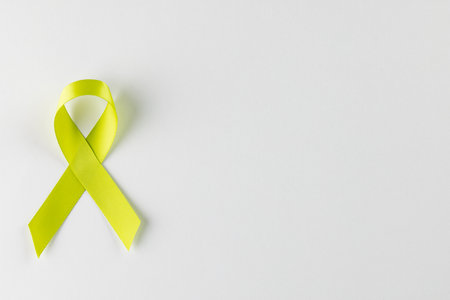 Composition of light green std health awareness ribbon, on white background with copy space. Medicine, healthcare and health awareness concept.の写真素材