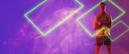 Caucasian male player holding tennis racket with illuminated rectangles against violet background....