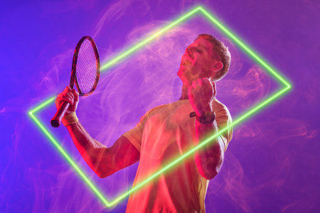Caucasian tennis player screaming and holding racket by illuminated rectangle on purple background....