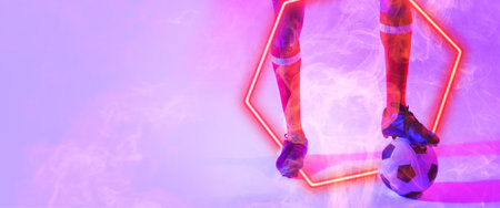 Low section of caucasian male player with leg on ball over illuminated hexagon shape, copy space....