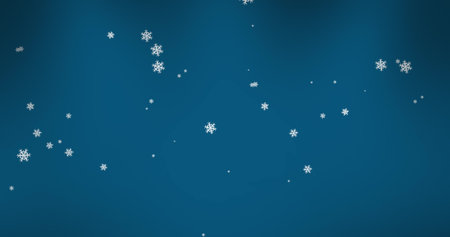Composite of christmas snow falling over blue background. Christmas, festivity, celebration and tradition concept digitally generated image.の写真素材