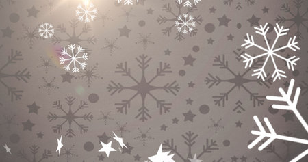 Multiple stars and snowflakes icons floating and spot of light against grey background. christmas...