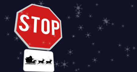 Image of snow falling over christmas road sign on black background. christmas, tradition and celebration concept digitally generated image.の写真素材