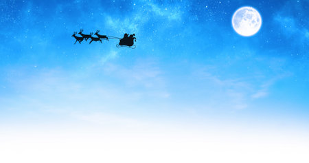 Image of santa claus in sleigh with reindeer over moon and sky. christmas, tradition and celebration concept digitally generated image.の写真素材