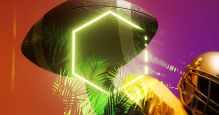 Cropped hand of american football player holding ball by illuminated plants and hexagon, copy space. Composite, sport, competition, illustration, glowing, nature, shape and abstract concept.の写真素材