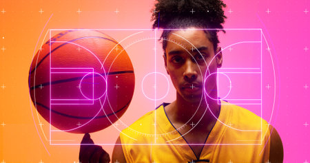 Composite of illuminated basketball court over portrait of serious biracial male player with ball. Copy space, sports field, sport, competition, illustration, glowing, shape and abstract concept.の写真素材
