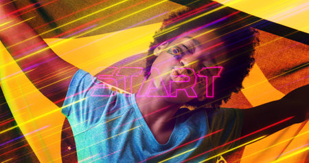 Illuminated start text and blurred lights over biracial female soccer player with brazilian flag. Composite, sport, competition, puckering lips, face paint, long exposure, patriotism, abstract.の写真素材