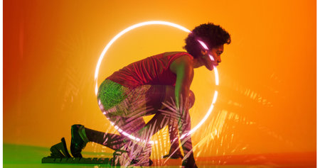 Biracial female athlete crouching at starting position by illuminated plants and circle, copy space....