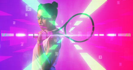 Side view of biracial female tennis player with racket standing over illuminated light beams. Copy space, contemplation, composite, sport, competition, match, glowing, shape and abstract concept.の写真素材
