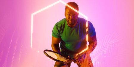 Illuminated hexagon over african american male player holding tennis racket on pink background. Copy...
