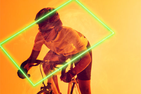 Rectangle neon over determined african american cyclist riding bicycle against yellow background. Digital composite, sport, cycling, athlete, copy space, competition.の写真素材