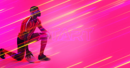 African american rugby player with ball kneeling by start text over illuminated long exposure. Pink, copy space, composite, sport, competition, beginning, playing, match and abstract concept.の写真素材