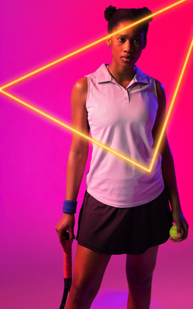 African american female tennis player with racket and ball by glowing triangle over pink background....