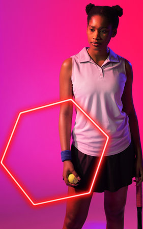 African american female tennis player holding ball and racket by illuminated hexagon. Copy space, composite, sport, shape, competition, pink, contemplation, match and abstract concept.の写真素材