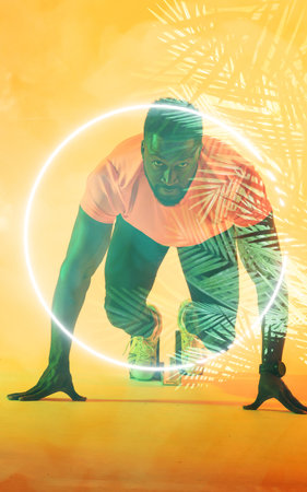 African american male runner sprinting off at starting block by illuminated circle and plants. Copy...