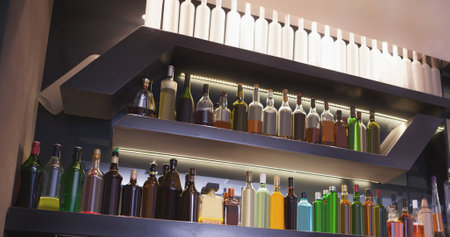 Image of interior of bar with rows of bottles. National beer day and hospitality concept digitally generated image.の写真素材