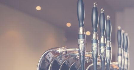Image of close up of beer tabs in bar. National beer day concept digitally generated image.の写真素材