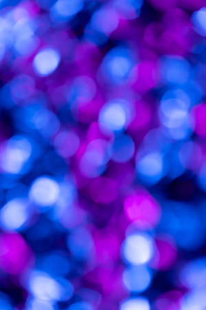 Close up of shiny multi coloured bokeh background with copy space. Colour, texture and light.の写真素材