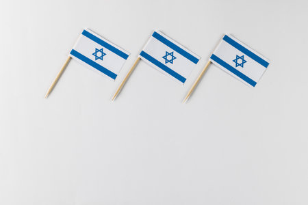 Close up of three flags of israel with copy space on white background. Jewish religion and tradition.の写真素材