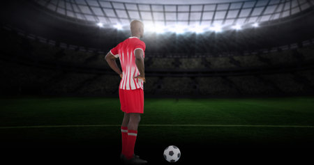 Image of stadium over african american male soccer player. Global sport and digital interface concept digitally generated image.の写真素材
