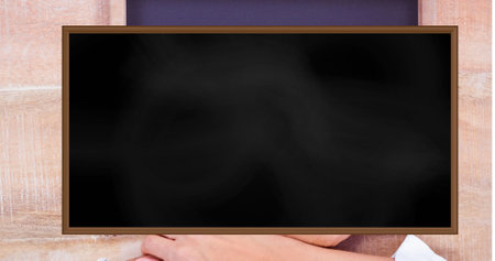 Blackboard with copy space in wooden frame. Education, school and learning concept digitally...