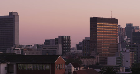 Composition of modern buildings over sky. Technology, computing and digital interface concept digitally generated image.の写真素材