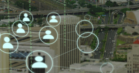Image of network of connections with icons and binary coding over cityscape. Global networks, business, finances, computing and data processing concept digitally generated image.の写真素材