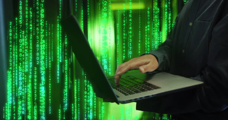 Image of binary coding over caucasian male worker using laptop in server room. Global technology and...