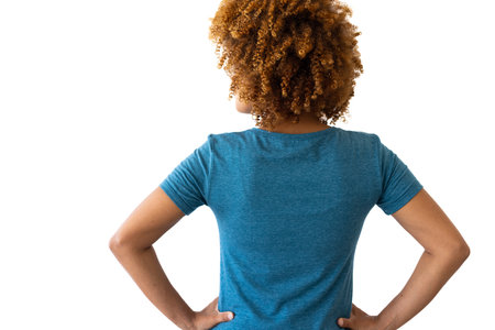 Biracial woman wearing blue t-shirt with copy space on white background. Clothes, fashion, style and design.の写真素材