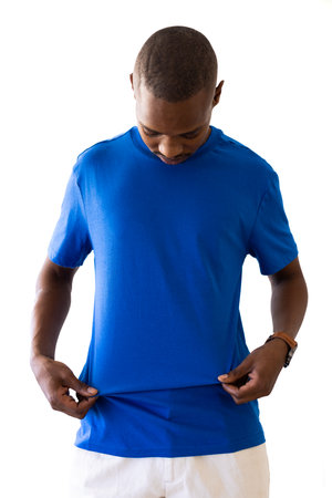 African american man wearing blue t-shirt with copy space on white background. Clothes, fashion, style and design.の写真素材