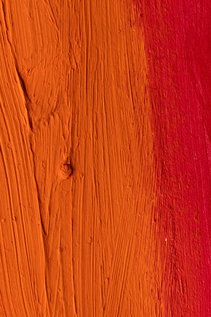 Close up of orange and red paint stripes with copy space. Abstract background, pattern and colour.の写真素材