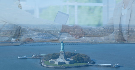 Composition of businesswoman hand shake in office over cityscape. business, finances, success and communication concept digitally generated image.の写真素材