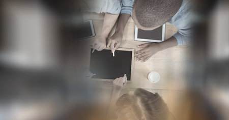 Composition of diverse business team in meeting room with double exposure. global business and success concept digitally generated image.の写真素材