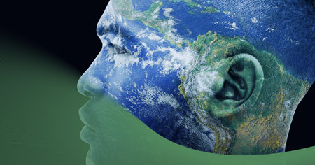 Composition of planet earth on man&#39;s face over green background. global environment and sustainability concept digitally generated image.の写真素材