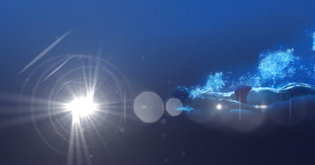 Composition of male swimmer swimming under water with copy space and glowing light. sport, fitness...