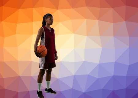 Composition of female basketball player with ball and copy space on patterned background. sport and competition concept digitally generated image.の写真素材