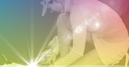 Composition of female tennis player kneeling on tennis court with tennis racket on tinted background. sports and competition concept digitally generated image.の写真素材