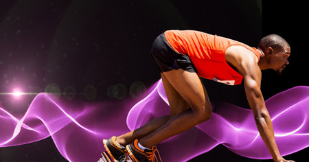 Composition of male athlete starting run with copy space and pink light trails. sports and competition concept digitally generated image.の写真素材