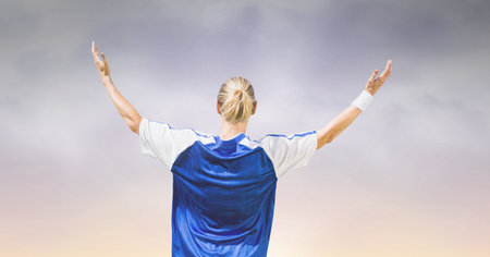 Composition of caucasian female football player with arms in air celebrating victory. sport, fitness...