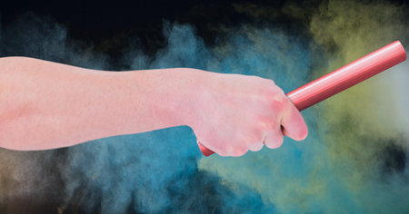 Composition of caucasian man athlete holding red relay baton with clouds of smoke in background. championships, sport and competition concept digitally generated image.の写真素材
