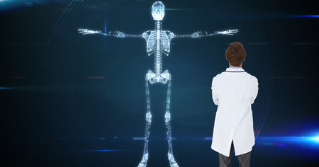 Composition of male doctor using virtual screen with skeleton model. global medicine and digital interface concept digitally generated image.の写真素材