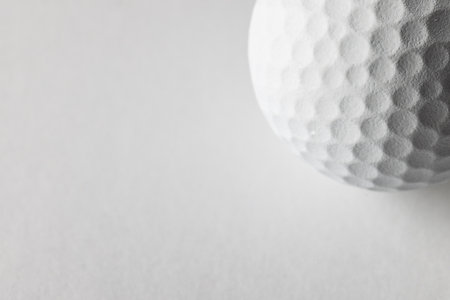 Close up of white golf ball with copy space on white background. Golf, sports and competition concept.の写真素材
