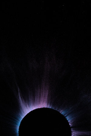 Close up of multi coloured powder and bowl with copy space on black background. Holi festival, colour, hindu tradition and celebration concept.の写真素材