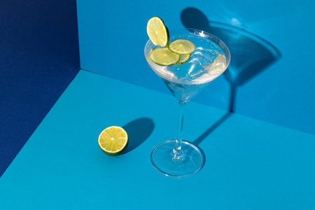 Glass of cocktail with line in blue space. Drinks, cocktails, alcohol, beverages and party concept.の写真素材