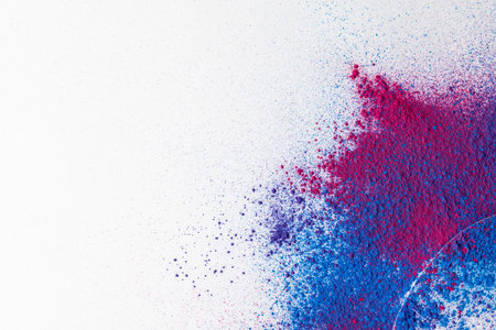 Close up of multi coloured powder with white circle and copy space on white background. Holi festival, colour, hindu tradition and celebration concept.の写真素材